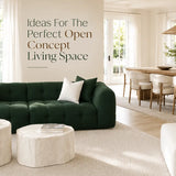 Open concept living and dining room with green sofa
