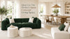 Open concept living and dining room with green sofa