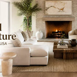 Living room with beige sofa, fireplace, and wooden coffee table.