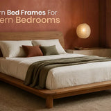 Modern wooden bed frame in a warm, contemporary bedroom with minimalist décor.